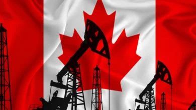 silhouette of drilling rigs and oil derricks with canadian flag in background Detafour