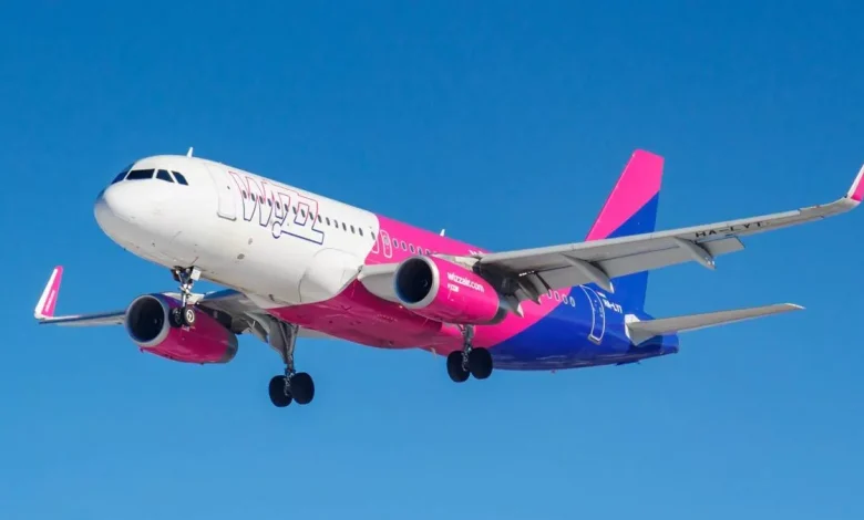 1 Aircraft Airbus A320 232WL HA LYT of Wizz Air against blue sky in sunny morning going to landing a Detafour