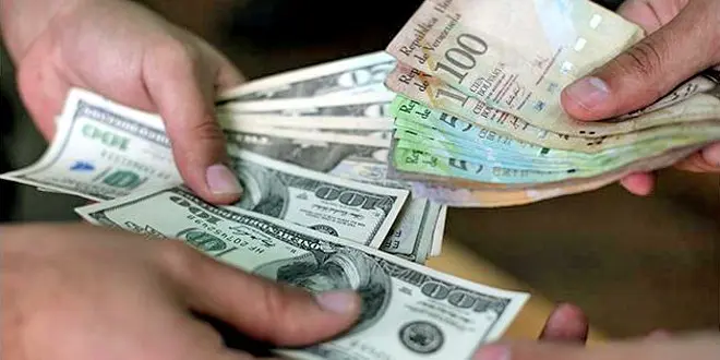 حملة واسعة في فنزويلا ضد تجارة الدولار في السوق السوداء 1 dolares bolivares cambio.jpg Detafour